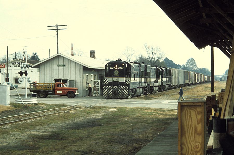 Southern Railway Extra 3927 West stops by the depot at Wadley, Georgia in 1975